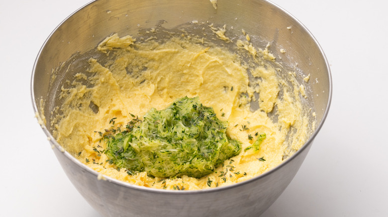 mixing zucchini into cake batter