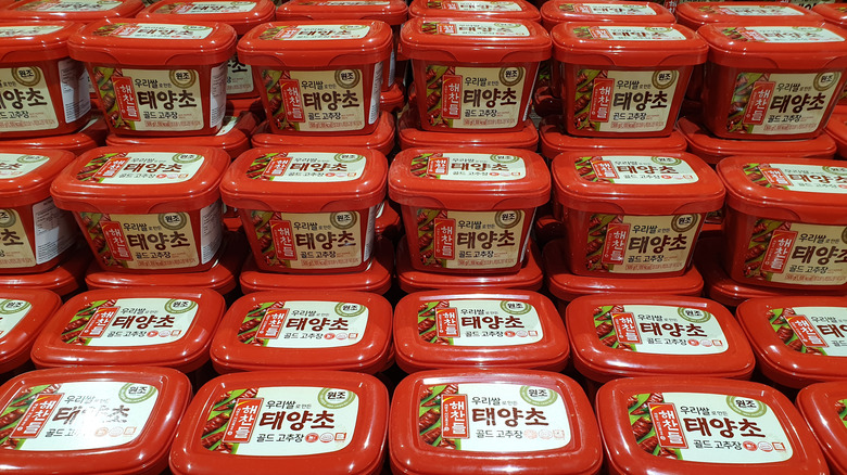 gochujang tubs stacked on shelf