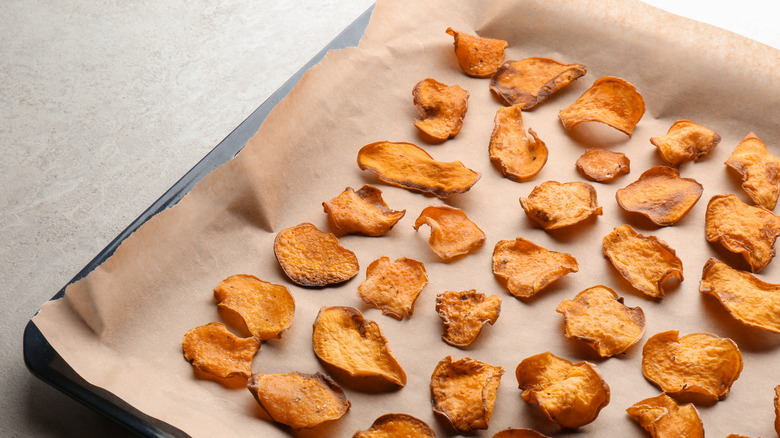 dried sweet potato on a baking sheet