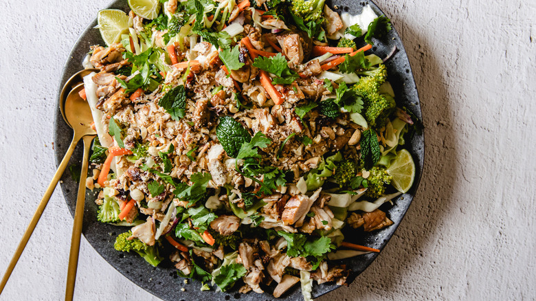 Plate of salad with spoons