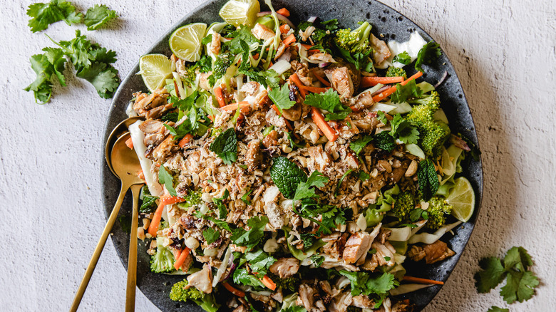 Plate of salad with spoons