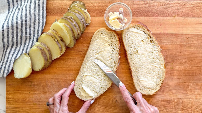 hand buttering bread