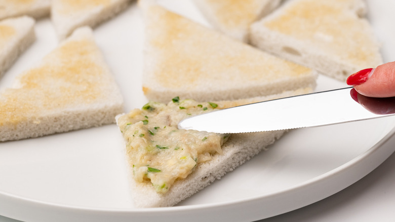 spreading shrimp paste on toast