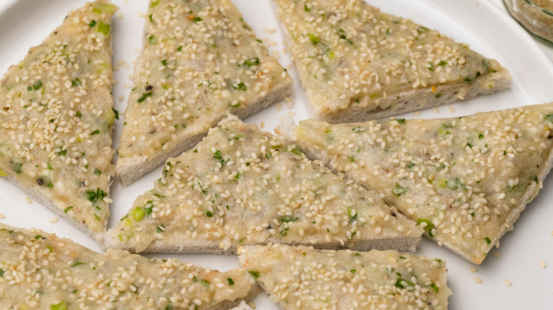 uncooked shrimp toast with seeds