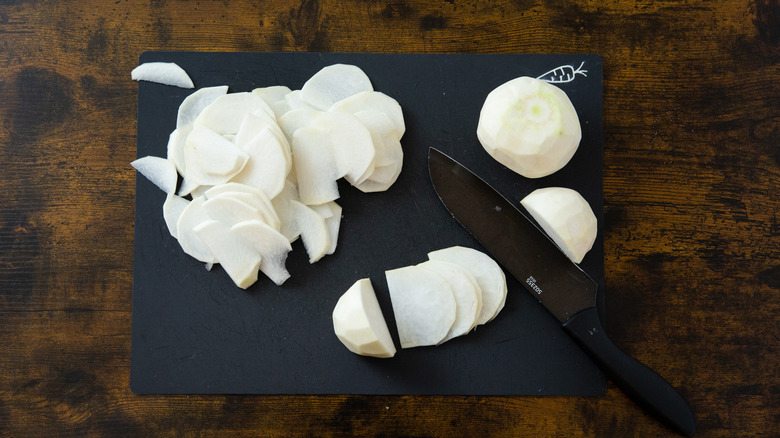 sliced turnips on cutting board 