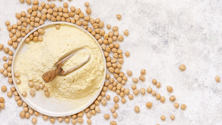 chickpea flour surrounded by chickpeas