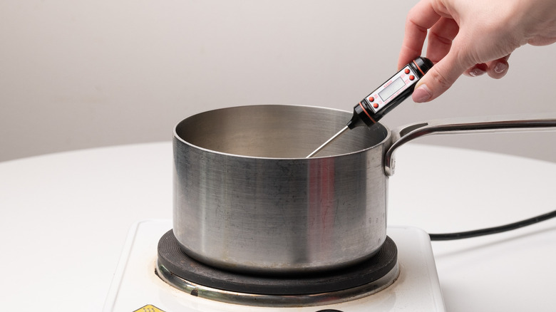 candy thermometer in saucepan