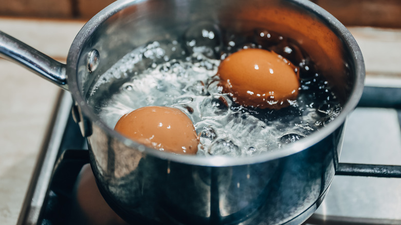 Eggs boiling in a pan