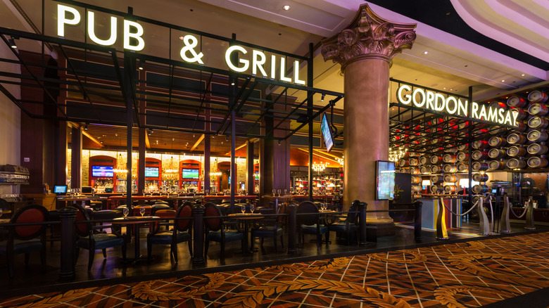 Gordon Ramsay Pub and Grill restaurant storefront with dining tables set up