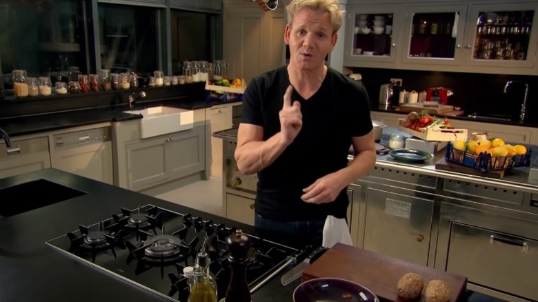 Gordon Ramsay speaking in kitchen with potatoes