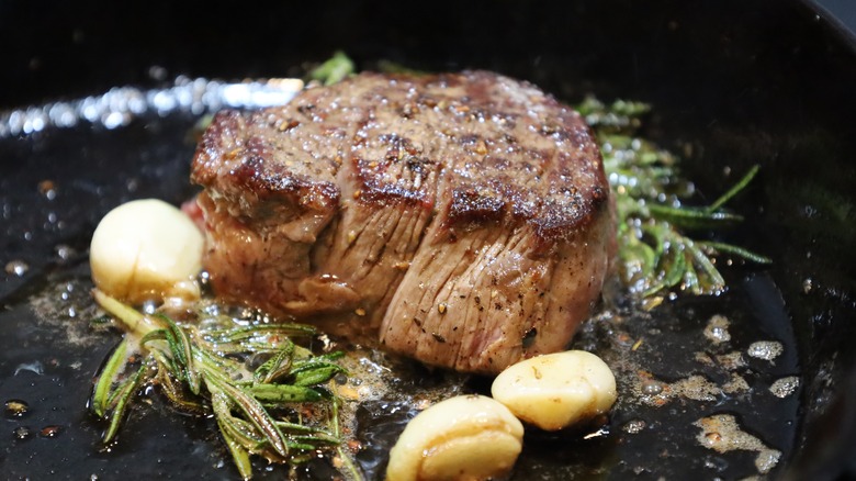 seared steak in pan