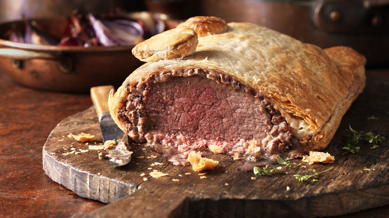 beef wellington on a wooden board