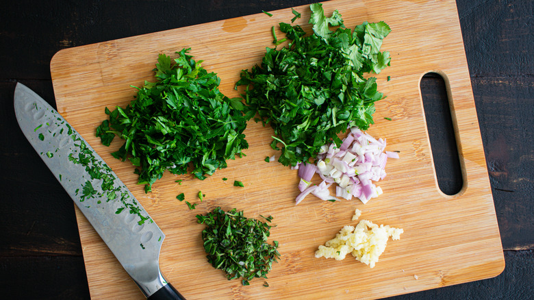 Chopped herbs on cutting board