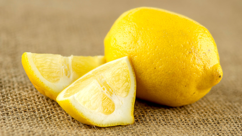 Whole and cut lemons