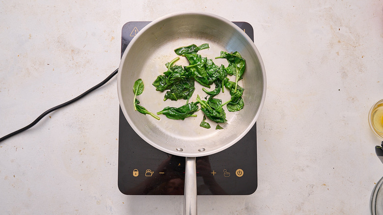 sauteed spinach in a skillet