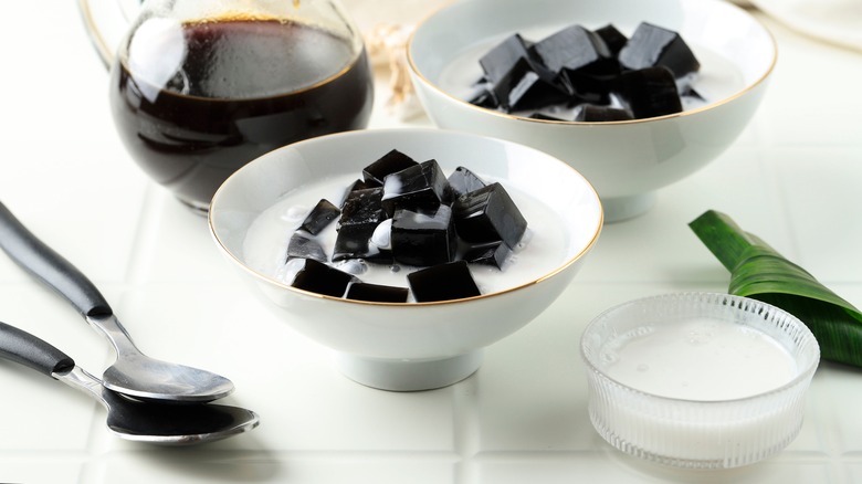 Grass jelly in bowl of milk