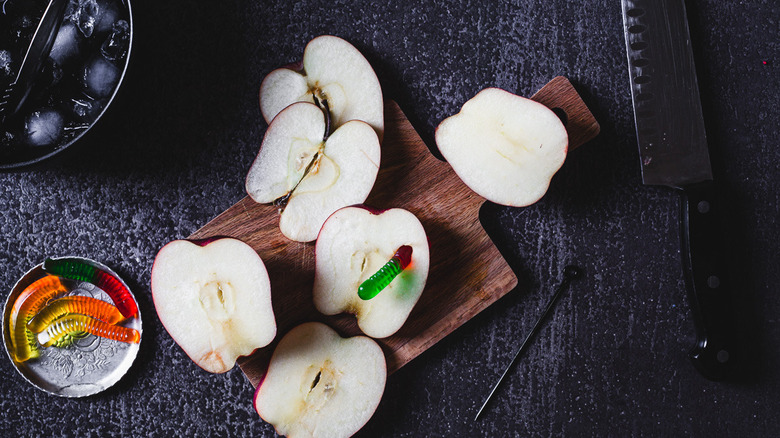 sliced apples with gummy worms