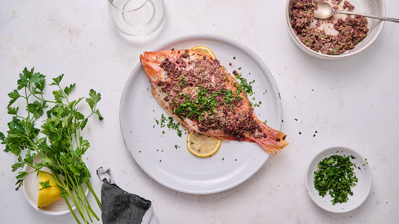 fish sprinkled with parsley on plate