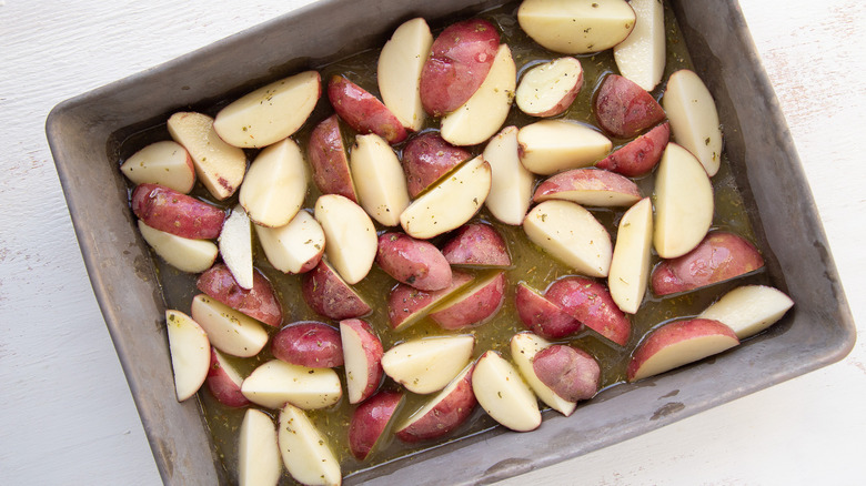 potatoes in pan with sauce