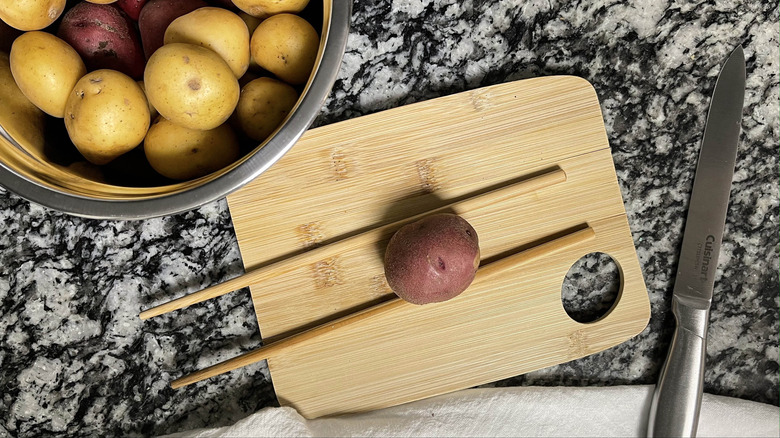 small potato with two chopsticks