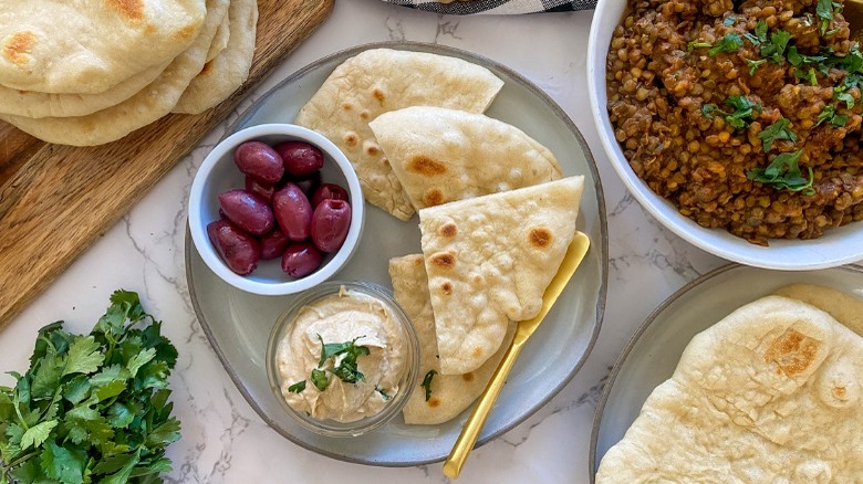 pita bread, olives, and lentils