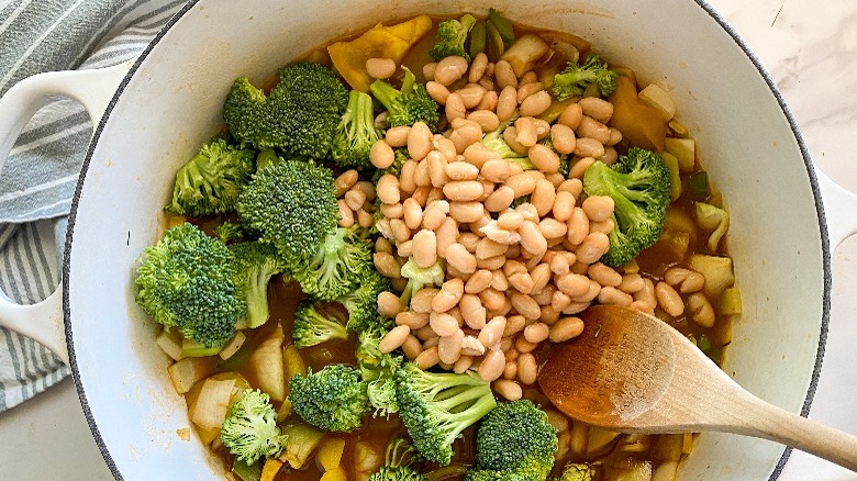 ingredients for soup in large white pot