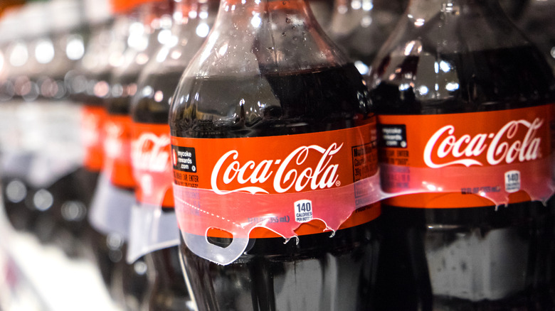 Coca-Cola bottles on shelf