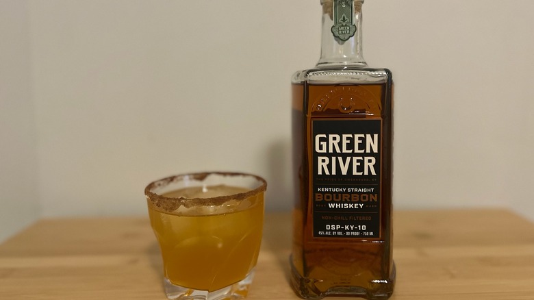 Green River Bourbon Whiskey bottle with an apple cider cocktail