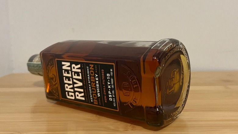 Green River Bourbon Whiskey bottle laying sideways