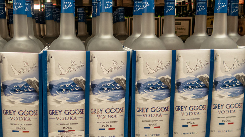 a row of grey goose bottles