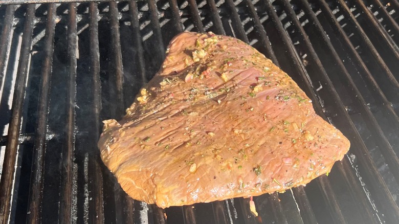 steak grilling on first side