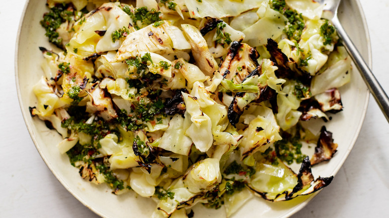 cooked cabbage in white bowl