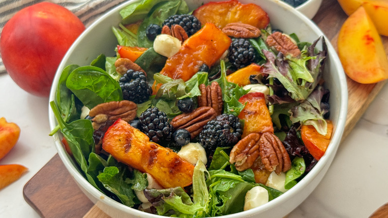 close up of nectarine salad in white bowl