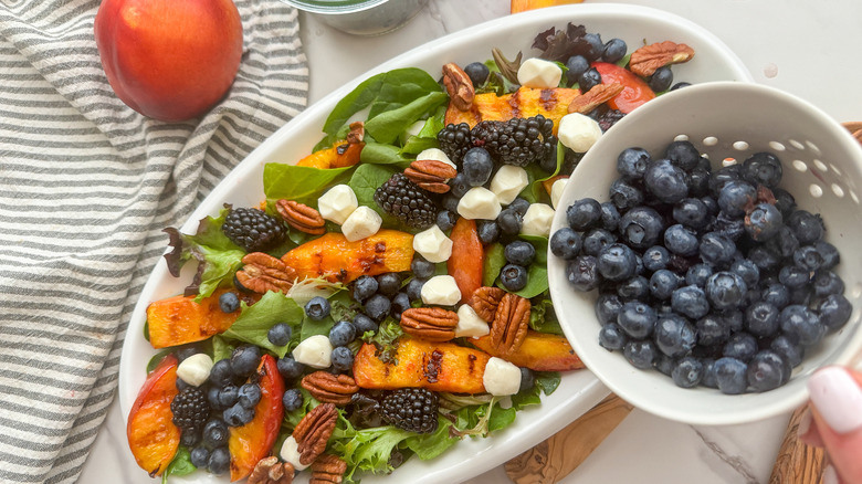 adding blueberries to platter