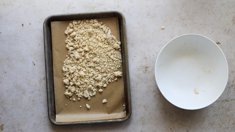 Baked pine nut crumble on tray