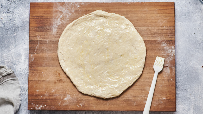 pizza dough stretched into crust