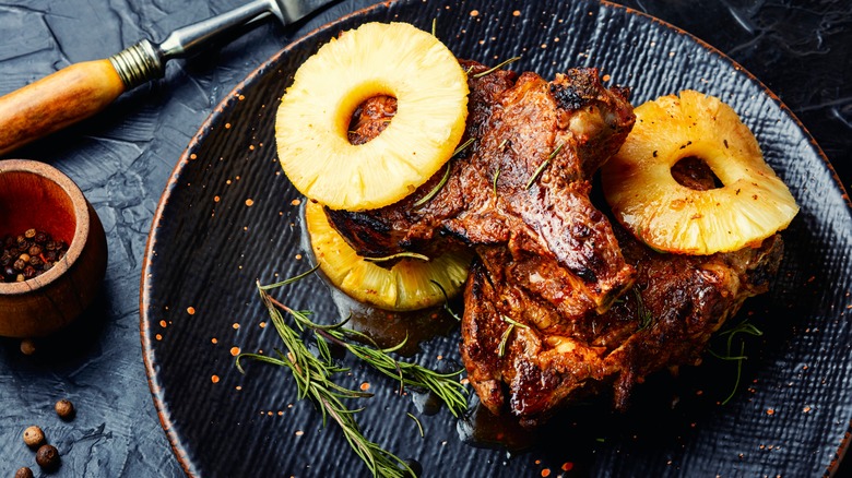 Grilled pineapple rings over steak