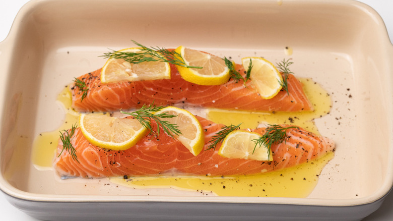 raw salmon in baking pan