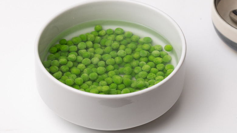 peas in bowl of water