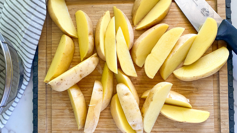 cut potatoes on board