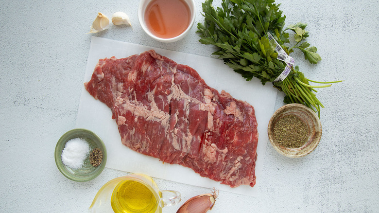 raw skirt steak with ingredients