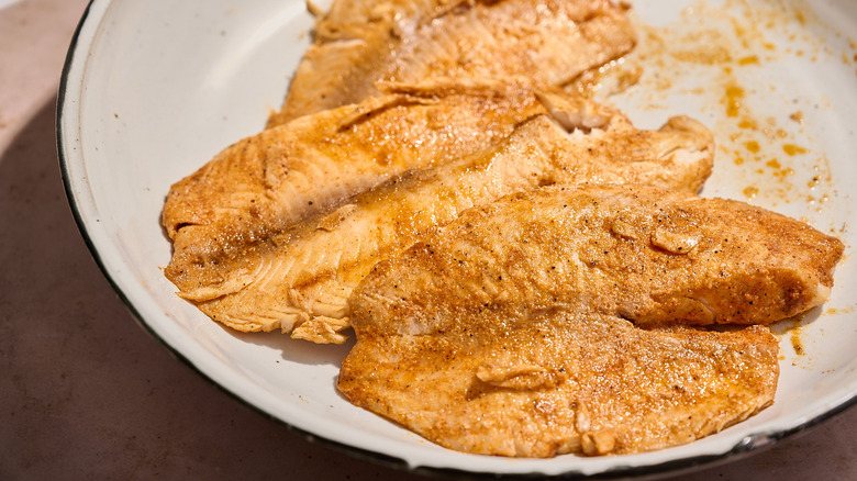 grilled tilapia in a platter