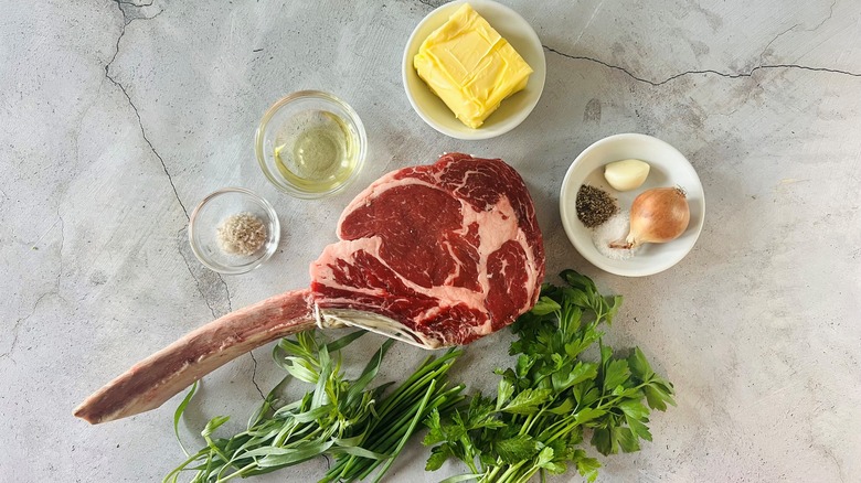 tomahawk steak with seasonings and ingredients