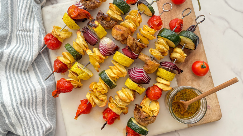 grilled skewers on board