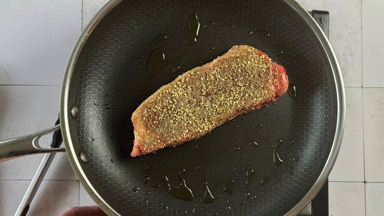 searing steak in pan