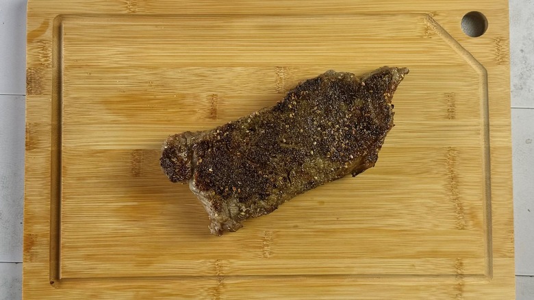 grilled za'atar steak on board