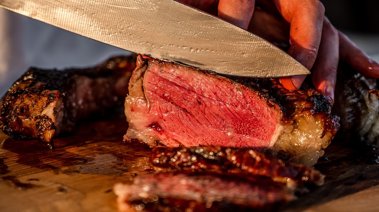 slicing juicy beef