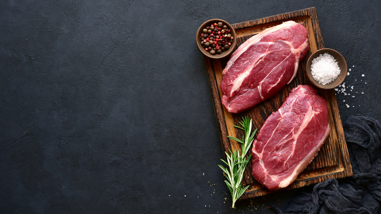 steaks on cutting board