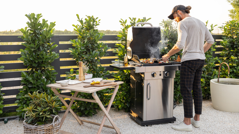 man grilling outside