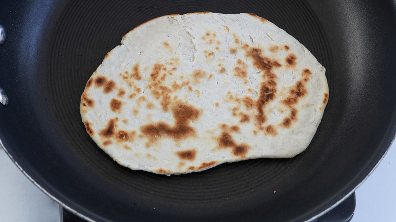 cooked flatbread in pan